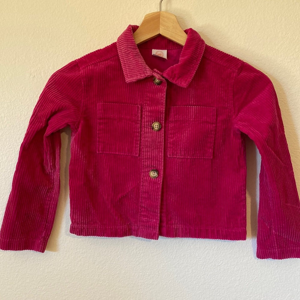 Pink corduroy chore coat.